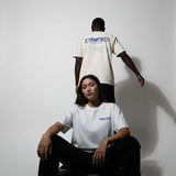 Oversized XYPHERED Clothing streetwear t-shirts worn by models in a lifestyle setting, showcasing urban style and comfort.