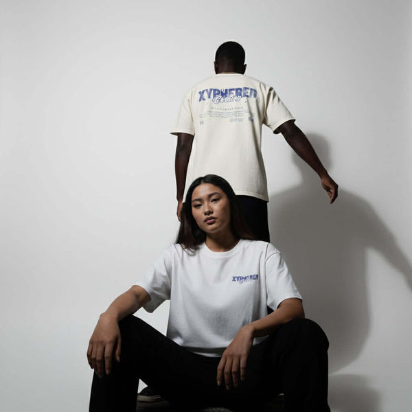 Oversized XYPHERED Clothing streetwear t-shirts worn by models in a lifestyle setting, showcasing urban style and comfort.