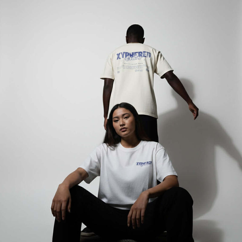 Oversized XYPHERED Clothing streetwear t-shirts worn by models in a lifestyle setting, showcasing urban style and comfort.